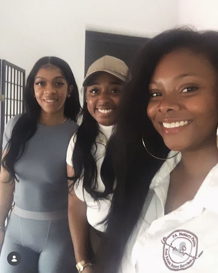 Khalia Luff of Sankofa Signings with clients wearing the Sankofa Signings notary jacket