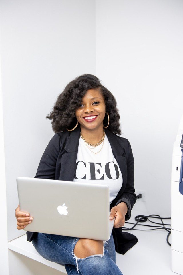 Khalia Luff, founder and CEO of Sankofa Signings, working from her laptop