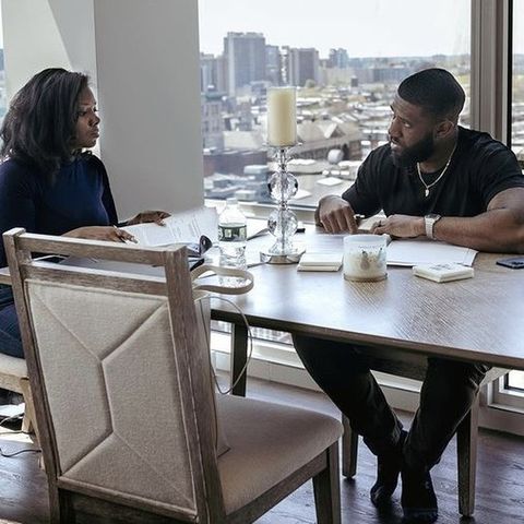 Khalia Luff at the table for a real estate closing